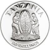 Аверс монеты Танзании: в центре герб Танзании - фигуры мужчины и женщины, поддерживающие щит. Сверху крупно полукругом надпись TANZANIA, снизу номинал 100 SHILLINGS.